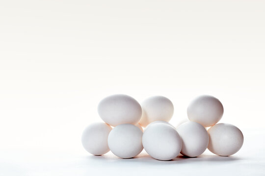 White eggs in white background, photo in high key
