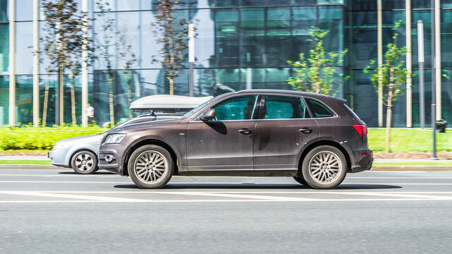 Audi Q5 car moving on the street. Compliance with speed limits on road concept. Dynamic exterior image