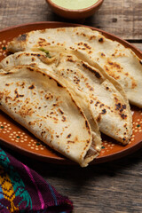 Mexican food. Quesadillas on wooden background