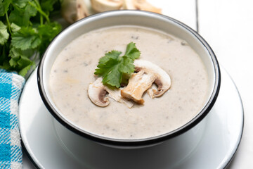 Cream of mushroom soup on white background. Vegetarian food