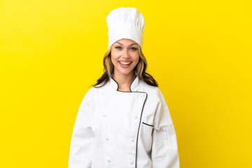 Young Russian chef girl isolated on yellow background with surprise facial expression