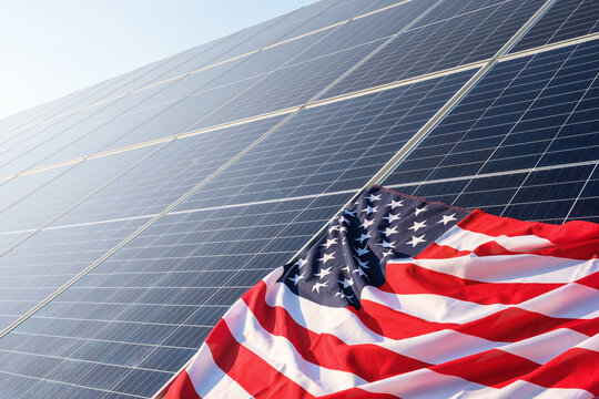 American flag close up on solar panels on solar power plant