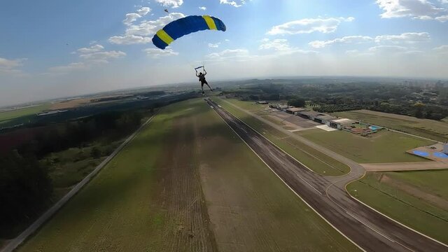 Video drone of a parachutist flying his parachute.