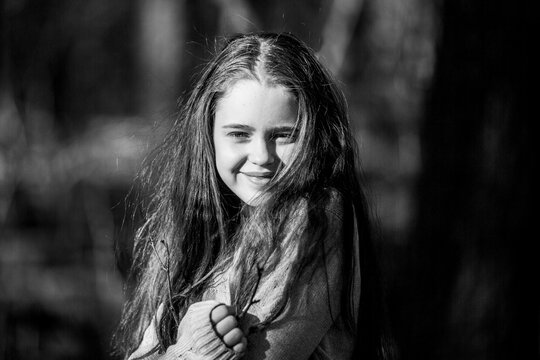 Portrait of cute teengirl in the Park. Black and white photo.