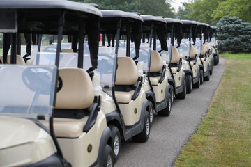 golf carts are ready prior to a tournament - obrazy, fototapety, plakaty