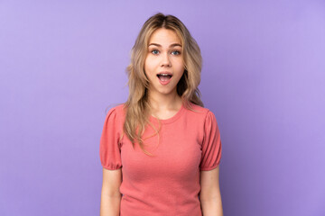 Obraz premium Teenager Russian girl isolated on purple background with surprise facial expression
