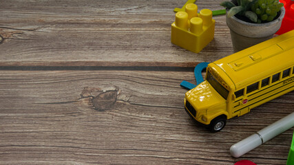 school bus on wood table for education or back to school  concept