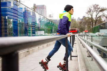 Young adult man skating on the street