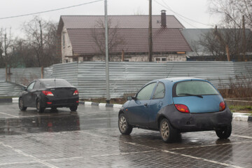 Naklejka premium Car in the parking lot in the city. The car is on the street.