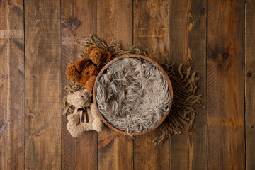 The tub has hairs on the wooden floor. for photographing newborns