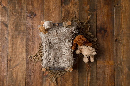 The tub has hairs on the wooden floor. for photographing newborns