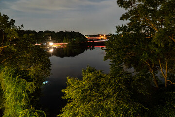 Fototapeta na wymiar Night view of the Charles River in Newton PA near I-95
