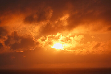 The sunlight appeared and disappeared from time to time between the clouds. The haze is very...