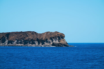 One of the small islands in the Hawaiian Islands. The view from the cruise ship. June 2019.