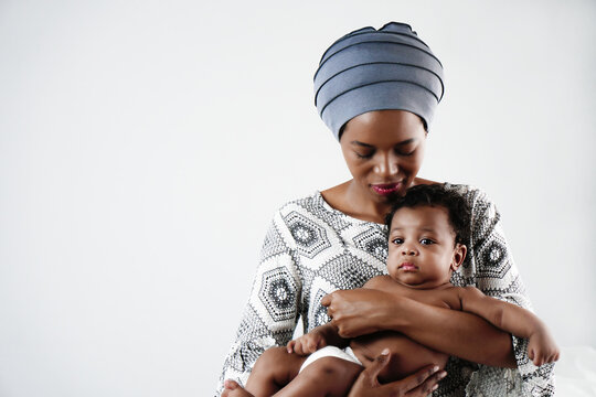 african american mother holding her adorable infant baby son
