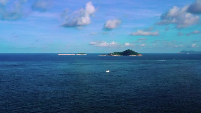 Aerial view during flyover around the Shek-O beach shore area in Hong Kong Peninsular. Aerial, beautiful seascape and a view on a small islands. 

