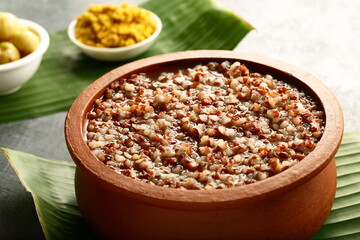 Homemade healthy diet meal - organic red rice porridge cooked in clay pottery.