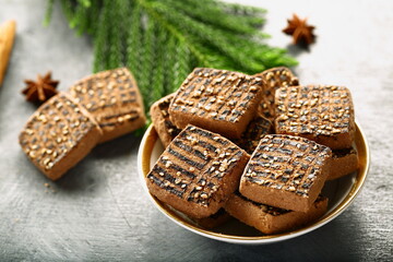 Bowl of delicious homemade chocolate cookies on a holiday background.