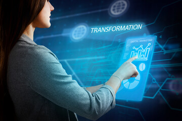 Business, Technology, Internet and network concept. Young businessman working on a virtual screen of the future and sees the inscription: Transformation