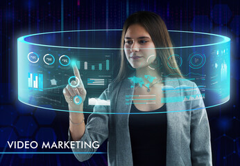 Business, Technology, Internet and network concept. Young businessman working on a virtual screen of the future and sees the inscription: Video marketing