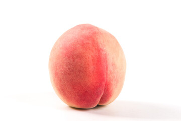 Ripe peach fruit close-up on white background