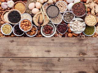 Obraz na płótnie Canvas Ingredients for the healthy foods selection in ceramic bowl. The concept of superfoods set up on white shabby wooden background with copy space.