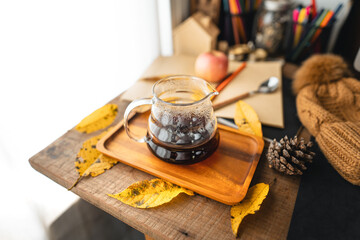 coffee in a mug on the desk in autumn