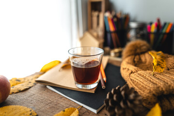 coffee in a mug on the desk in autumn