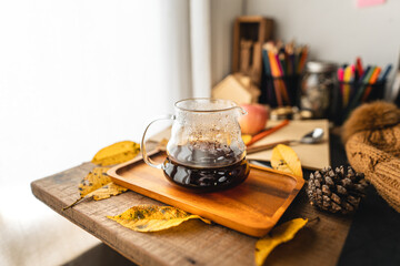 coffee in a mug on the desk in autumn
