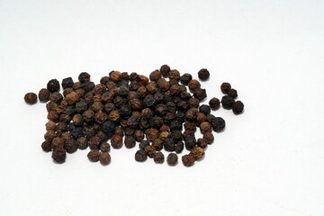 black pepper spices in white background