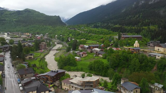 Aerial: river flowing through Mestia in Zemo Svaneti, Georgia Caucasus Mountains