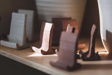 A shelf in a pottery workshop.