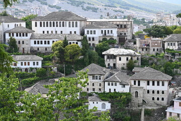 Obraz premium View of the old town of Gjirokastra in Albania with the traditional stone roofs, stone house roof 