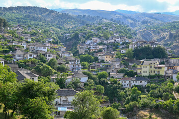 View of the old town of Gjirokastra in Albania with the traditional stone roofs, stone house roof	