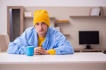Young man suffering at home