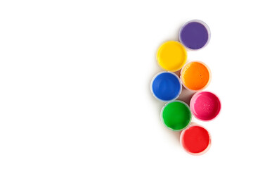 Set of colorful gouache jars isolated on white background. With copy space.