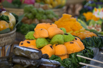selective focus Mixed fresh fruits and traditional sweets with tributes used in ritual sacrifices...
