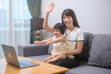 Happy mom and daughter relaxing at home