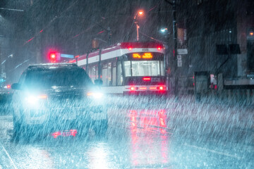 Streetcar and vehicle at night in Toronto