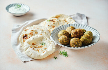 Fresh pita bread, falafel.