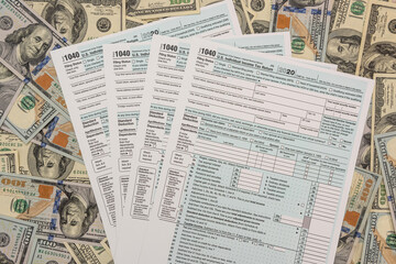 Tax Form 1040  with us 100 dollar banknotes