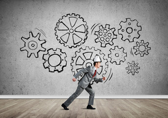 King businessman in elegant suit running in empty room with wooden floor