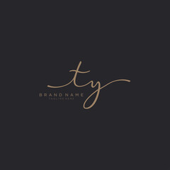 Letter TY gold Initial handwriting logo vector. Black background.