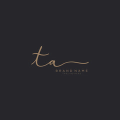 Letter TA gold Initial handwriting logo vector. Black background.