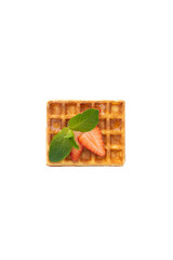 Belgium waffle with strawberry and mint on white isolated background