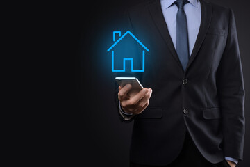 Real estate concept, businessman holding a house icon.House on Hand.Property insurance and security concept. Protecting gesture of man and symbol of house.