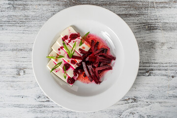 Boiled beet salad with soft feta cheese and sauce