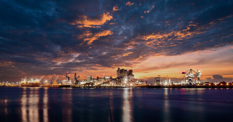 Fototapeta na wymiar Facilities at Rotterdam Harbor by Sunset