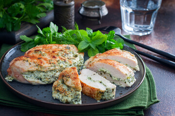 Baked chicken breast stuffed with cheese and spinach, horizontal
