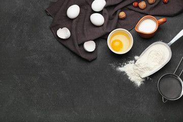 Ingredients for preparing bakery and utensils on dark background